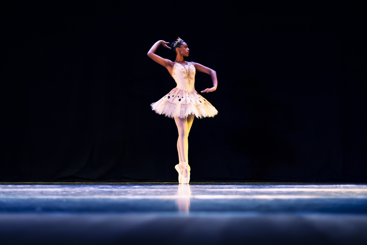 Black girl dancing Raymonda ballet on stage